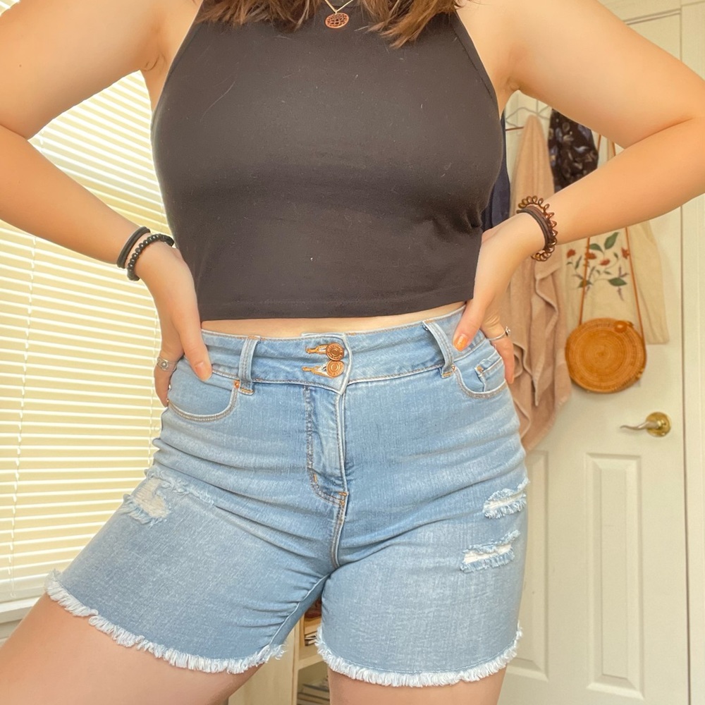 Distressed shorts by the brand Royalty For Me